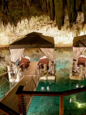 Spa massage beds on a floating dock in a cave in Bermuda