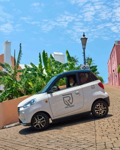 A microcar is driving around St. George's