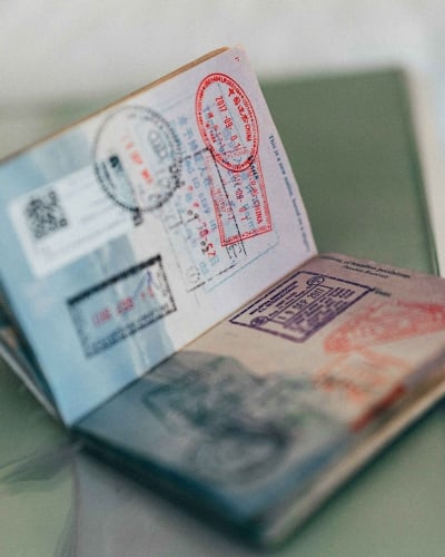 An image of a passport with stamps inside.