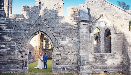 couple getting married in unfinished church
