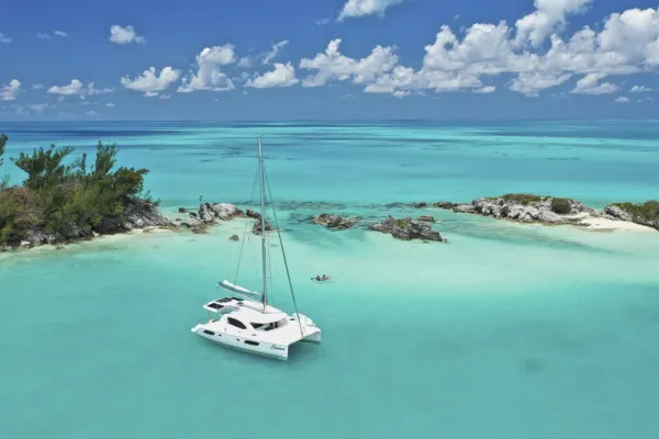 A sailboat with its sails down in a bay in Bermuda