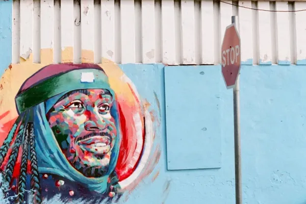 A street art mural of a man on the street of Bermuda