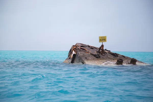 The Vixen, a shipwreck, sticks out of the waters off Bermuda