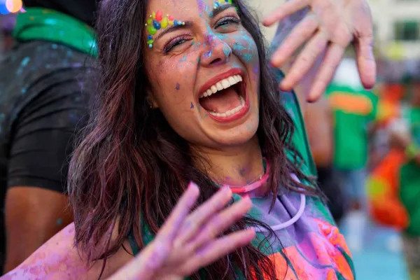 A reveller covered in coloured powder from a colour run at Carnival in Bermuda