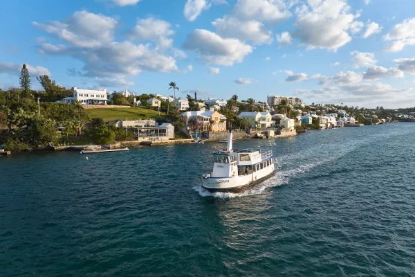 A small motor boat cruising along the Bermuda coast