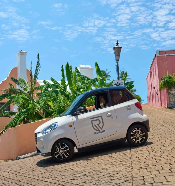 A microcar is driving around St. George's