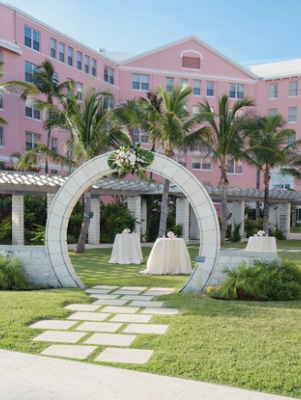 A moongate with a wedding setup in the Hamilton Princess courtyard 