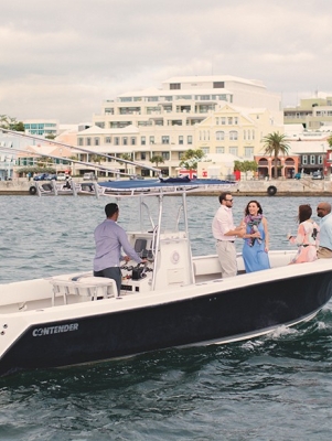 Group of people on a boat driving