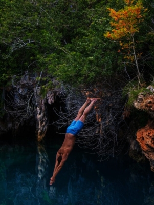 man diving into the ocean