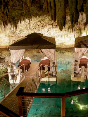Spa massage beds on a floating dock in a cave in Bermuda