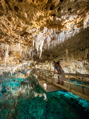 couple exploring a cave