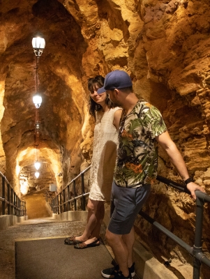 A couple walking through Crystal Caves in Bermuda
