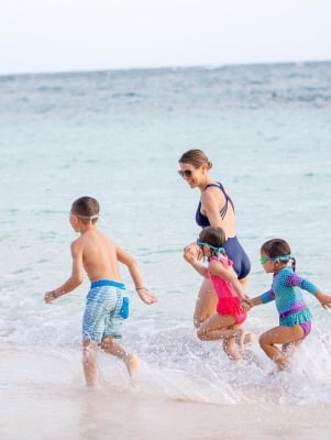 A family running on the beach in Bermuda