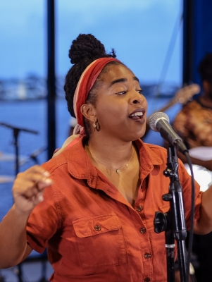 A woman is singing.