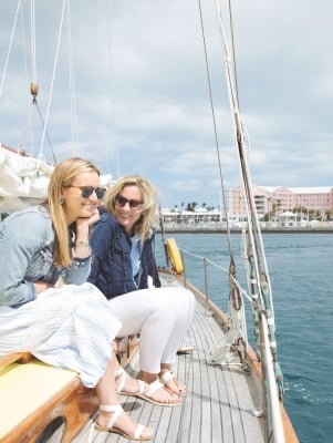 Two women are sitting on a boat.