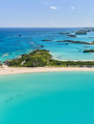 An aerial view of Cooper's Island with various beaches and Non Such Island