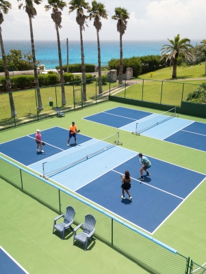 An aerial view of a group of people are playing pickleball.