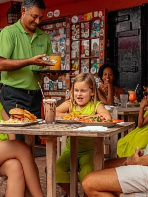 A family is eating at the Swizzle In.