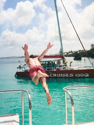 A man is diving into the water. 