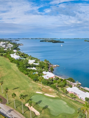 Aerial of newstead belmont hills with a sail boat floating by.