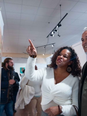 A couple are experiencing an art gallery.