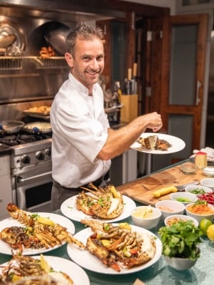 A chef is tabling food.