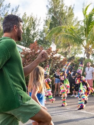 A family is dancing with Gombeys