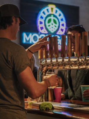 A close up of beer on a tap.
