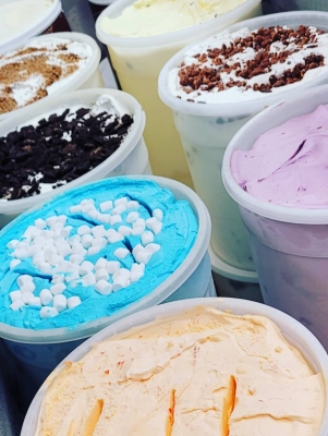 Colourful containers of ice cream.