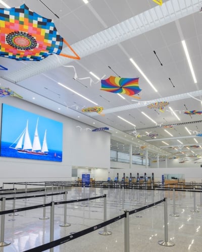 Interview of the LF Wade airport with colourful kites on the ceiling.