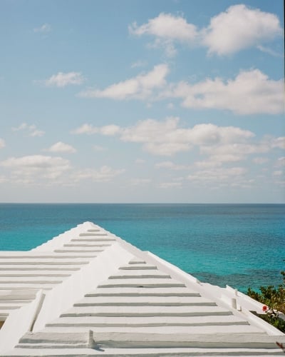 View of Bermuda house with calm waters. 