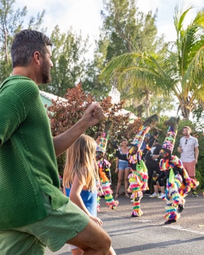 A family is dancing with Gombeys