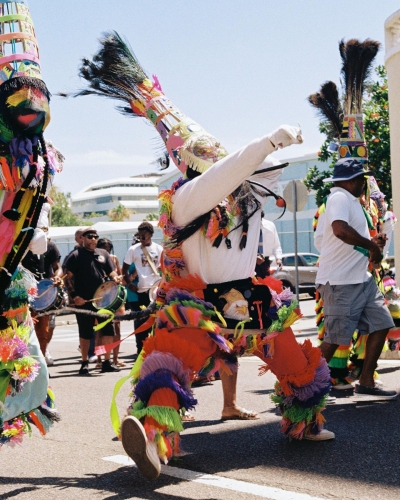 Bermuda's Gombey dance troupes, decked out in colourful regalia, playing drums, beer-bottle fifes and tin whistles.
