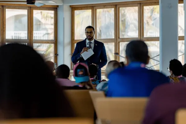 A man speaking in front of an audience