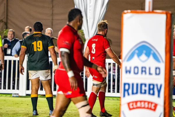 Rugby players walking on the field