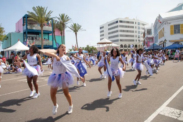 A group of dancers in a parade for Bermuda Day 