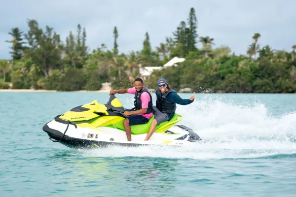Two people ride on a jet ski in Bermuda