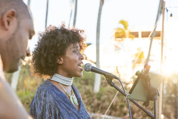 A group performs music outside at Barrs bay
