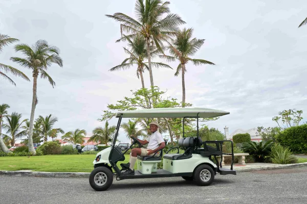 A man drives a golf cart in Bermuda