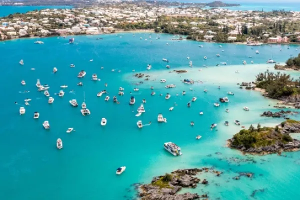 A collection of small boats on blue coastal waters in Bermuda