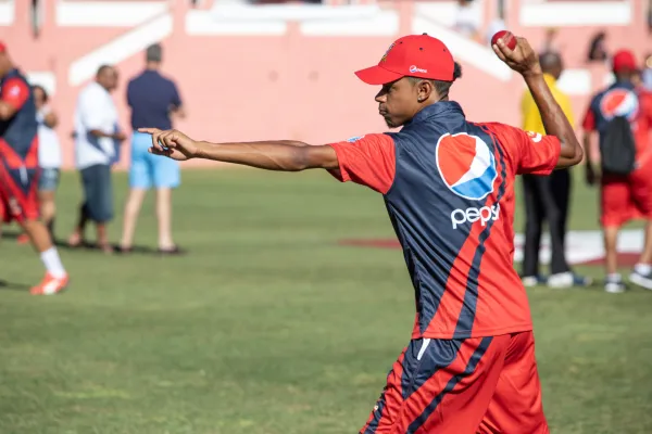 A cricket bowler prepares to throw  in Bermuda
