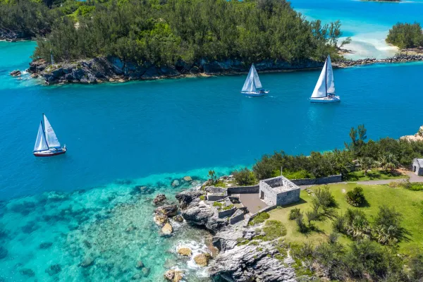 Sailboats race across blue waters in Bermuda