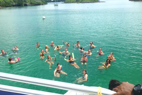 Swimmers in Bermuda wade in the ocean