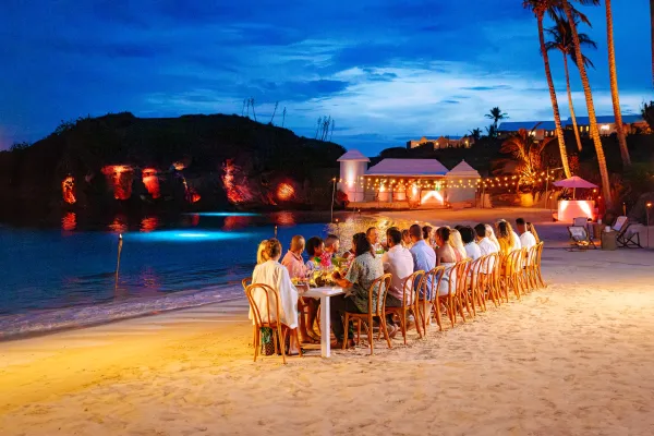 A group dining on the beach in Bermuda