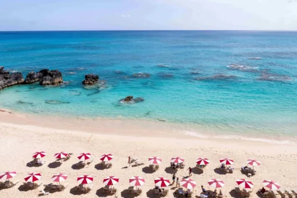 Red and white umbrellas on the Reefs beach in Bermuda