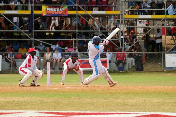 A cricket batsman swings at a ball during the Cup Match in Bermuda
