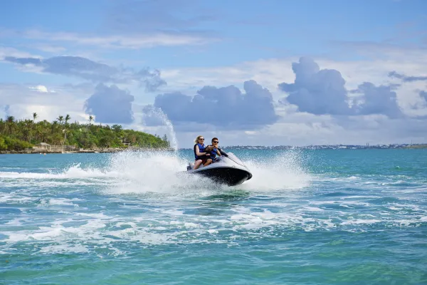A couple rides on a jet ski in Bermuda