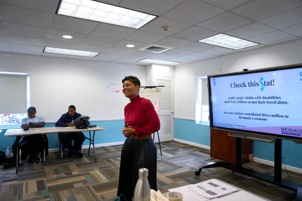 A woman hosts a seminar in Bermuda