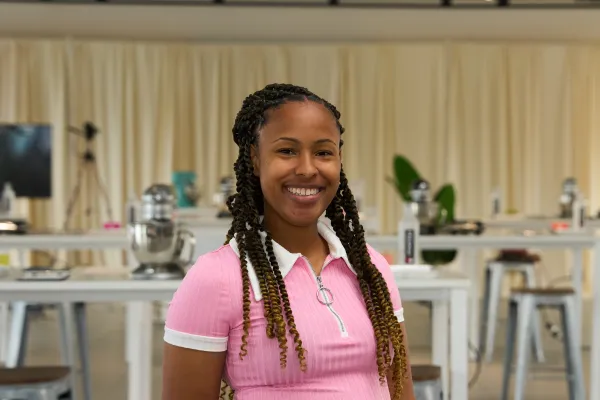 A smiling Bermuda Business owner in a cafe