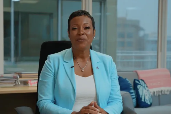 A woman presenting Bermuda Tourism Measures